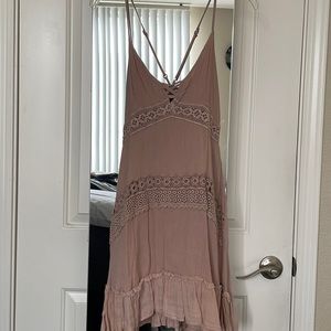 Blush pink crochet slipdress. Cries-cross back.